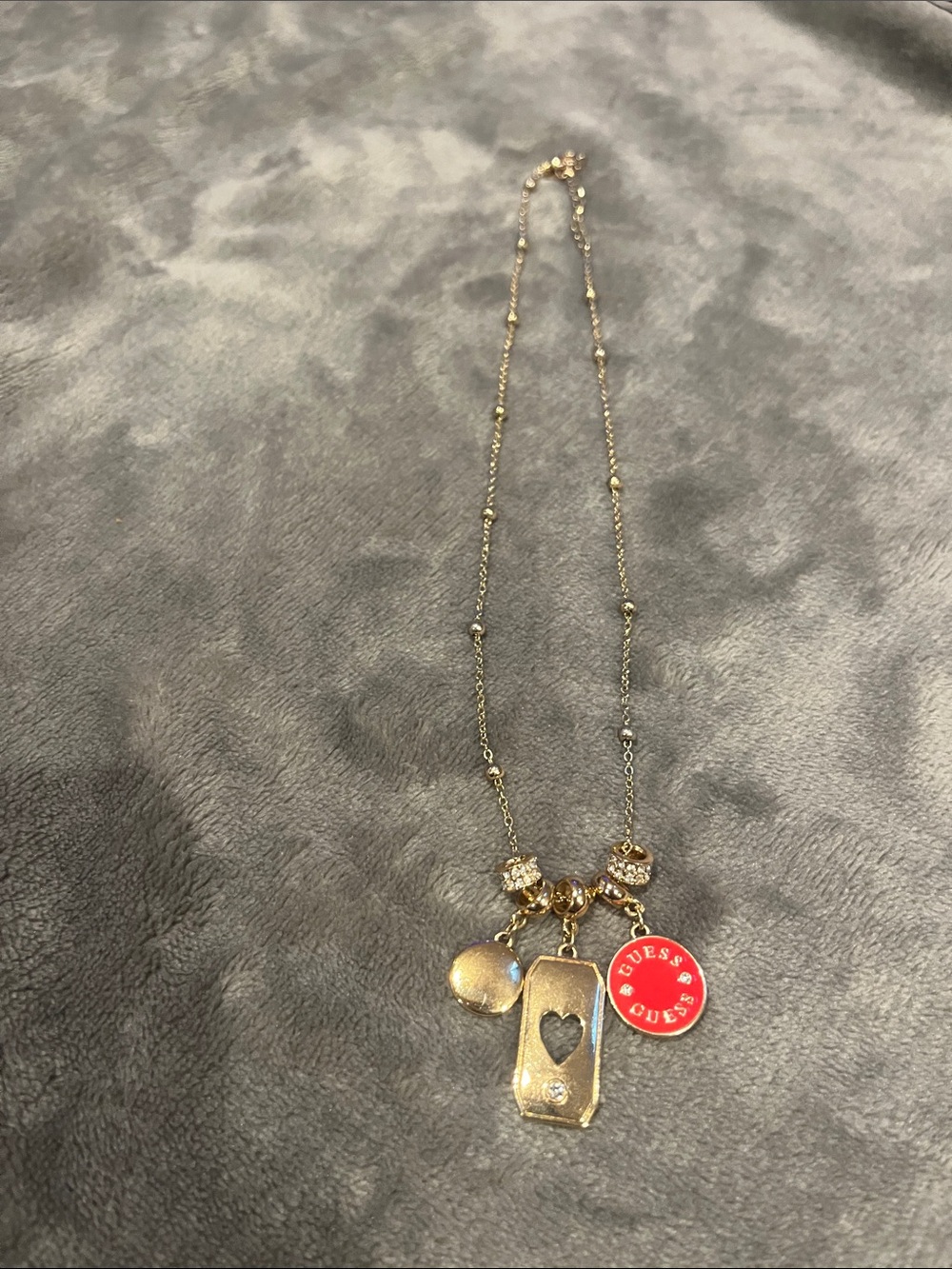 Guess Gold-Tone Charm Necklace with red Logo Disc